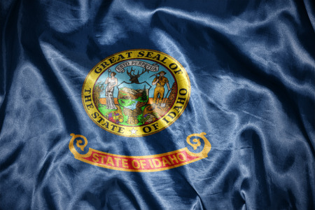 waving and shining  idaho state flagの写真素材