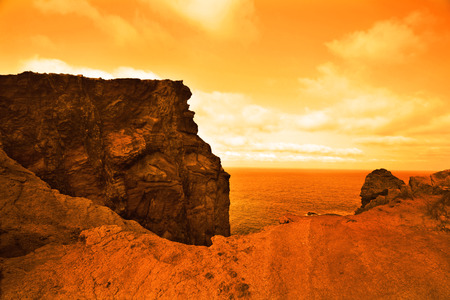 beautiful deserted planet with vast ocean in orange colorsの写真素材