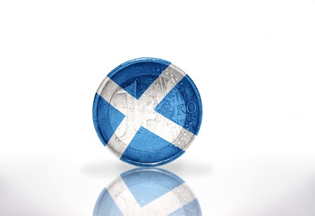 euro coin with scottish flag on the white backgroundの写真素材
