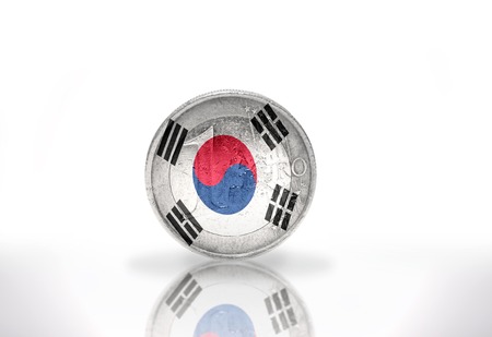 euro coin with south korea flag on the white backgroundの写真素材