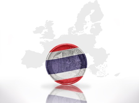 euro coin with thailand flag on the european union map backgroundの写真素材