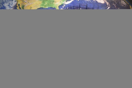 woman's  face with planet Earth texture and colombian flag inside the eye.の写真素材