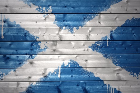colorful painted scottish flag on a wooden textureの写真素材