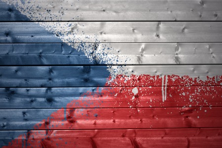 colorful painted czech flag on a wooden textureの写真素材