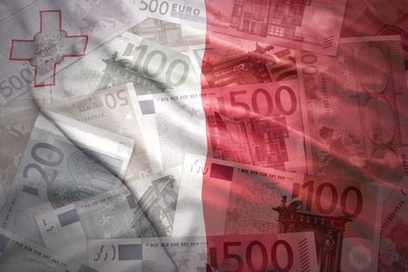 colorful waving maltese flag on a euro money backgroundの写真素材