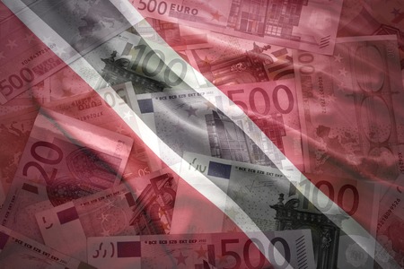 colorful waving trinidad and tobago flag on a euro money backgroundの写真素材