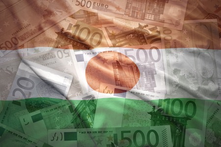 colorful waving niger flag on a euro money backgroundの写真素材