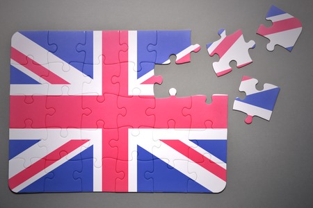 broken puzzle with the national flag of great britain on a gray backgroundの写真素材