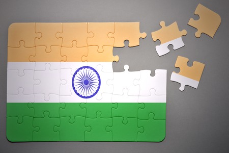 broken puzzle with the national flag of india on a gray backgroundの写真素材