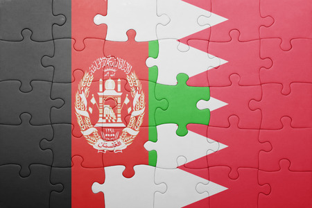 puzzle with the national flag of bahrain and afghanistan . conceptの写真素材
