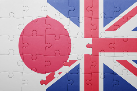 puzzle with the national flag of great britain and japan . conceptの写真素材