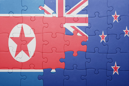 puzzle with the national flag of north korea and new zealand. concept