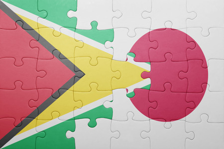 puzzle with the national flag of guyana and japan. conceptの写真素材