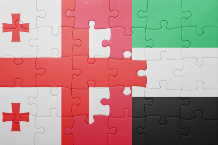puzzle with the national flag of united arab emirates and georgia . conceptの写真素材