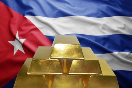 shining golden bullions on the cuban flag backgroundの写真素材