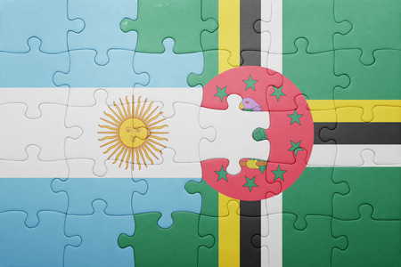 puzzle with the national flag of dominica and argentina .conceptの写真素材