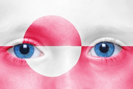 human's face with greenlandic flagの写真素材