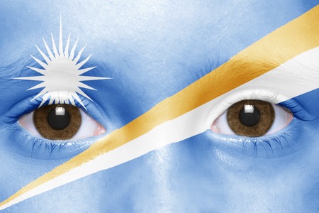 human's face with marshall islands flagの写真素材