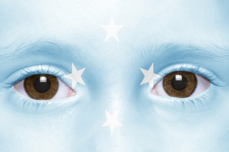 human's face with federated states of micronesia flagの写真素材