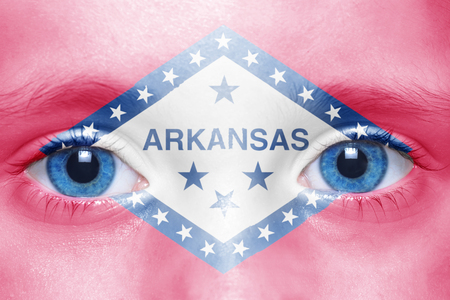 human's face with arkansas state flagの写真素材