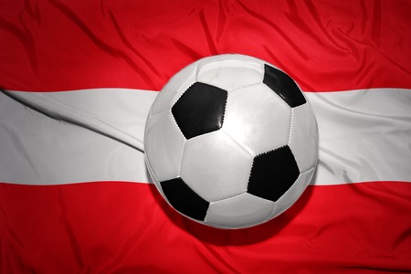 vintage black and white football ball on the national flag of austriaの写真素材