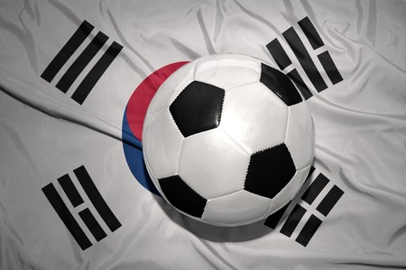 vintage black and white football ball on the national flag of south koreaの写真素材