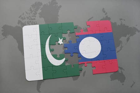 puzzle with the national flag of pakistan and laos on a world map background. 3D illustrationの写真素材