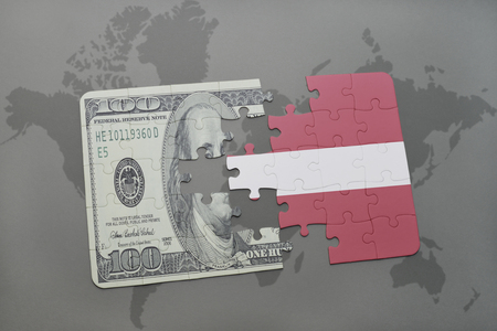 puzzle with the national flag of latvia and dollar banknote on a world map background. 3D illustrationの写真素材