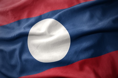 waving colorful national flag of laos.の写真素材
