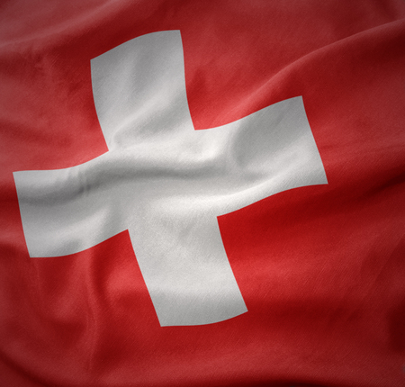 waving colorful national flag of switzerland.の写真素材