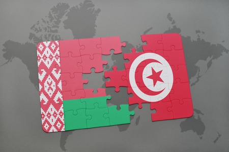 puzzle with the national flag of belarus and tunisia on a world map background. 3D illustrationの写真素材