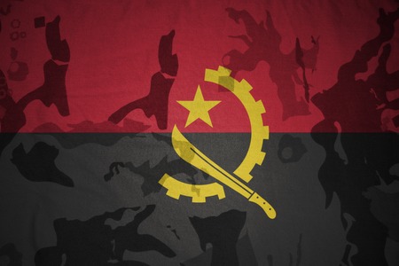 flag of angola on the khaki texture background. military conceptの写真素材