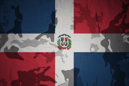 flag of dominican republic on the khaki texture background. military conceptの写真素材