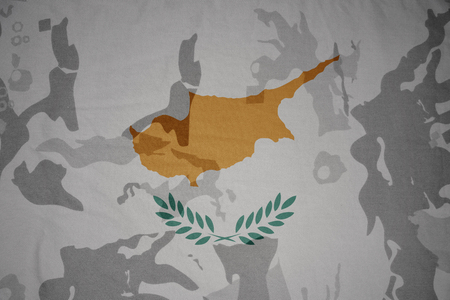 flag of cyprus on the khaki texture background. military conceptの写真素材