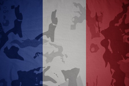 flag of france on the khaki texture background. military conceptの写真素材