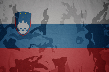 flag of slovenia on the khaki texture background. military conceptの写真素材