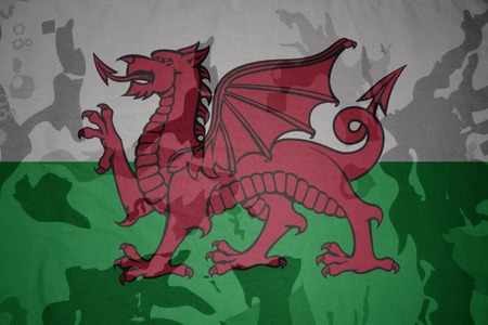 flag of wales on the khaki texture background. military conceptの写真素材