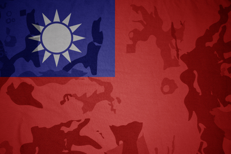 flag of taiwan on the khaki texture background. military conceptの写真素材