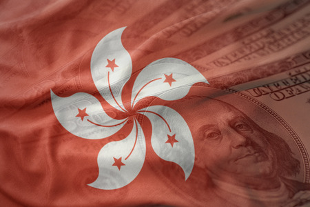 colorful waving national flag of hong kong on a american dollar money background. finance conceptの写真素材