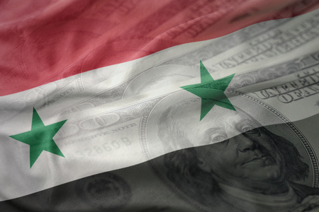 colorful waving national flag of syria on a american dollar money background. finance conceptの写真素材
