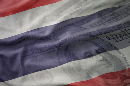 colorful waving national flag of thailand on a american dollar money background. finance conceptの写真素材