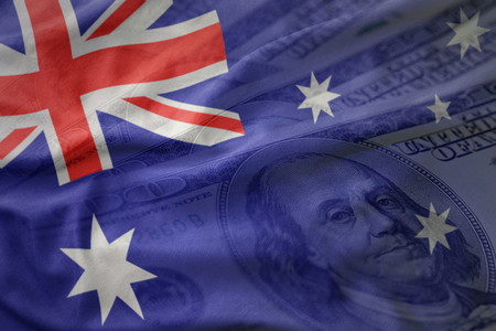 colorful waving national flag of australia on a american dollar money background. finance conceptの写真素材