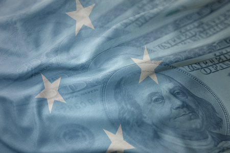 colorful waving national flag of Federated States of Micronesia on a american dollar money background. finance conceptの写真素材