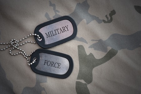 army blank, dog tag with text Military Force on the khaki texture background. military conceptの写真素材