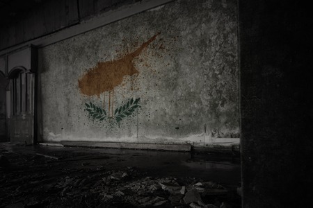 painted flag of cyprus on the dirty old wall in an abandoned ruined house. conceptの写真素材