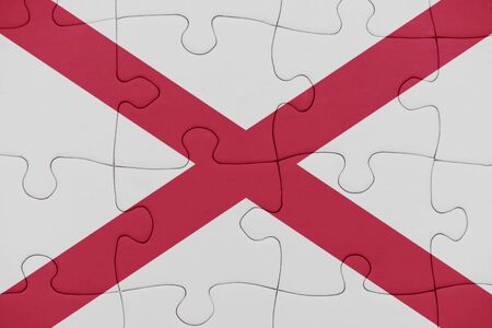 puzzle with the flag of alabama state. conceptの写真素材