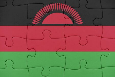 puzzle with the national flag of malawi. conceptの写真素材