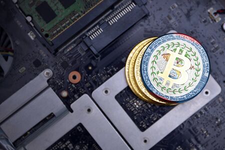 golden shining bitcoins with flag of belize on a computer electronic circuit board. bitcoin mining concept.の写真素材