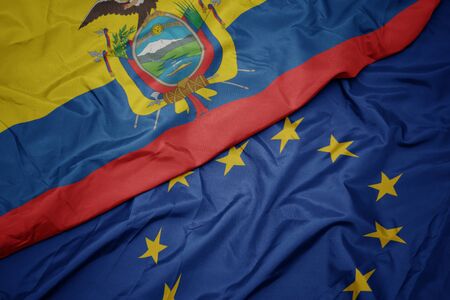 waving colorful flag of european union and flag of ecuador. macroの写真素材