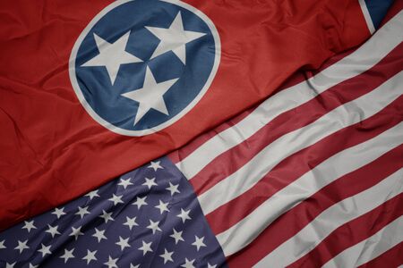 waving colorful flag of united states of america and flag of tennessee state. macroの写真素材